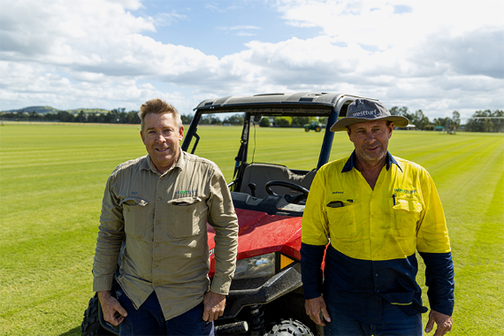 2 WestTurf owners standing